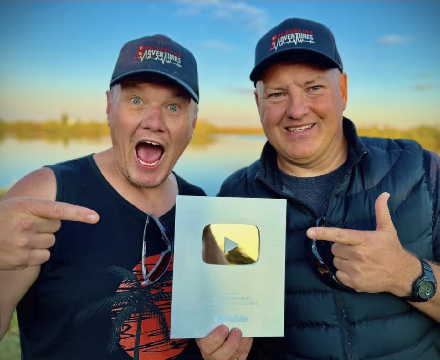 Bryce and his co-host from Bloodline Adventures holding their YouTube Silver Play Button